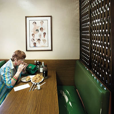 Painting of past employees by Diane Ainsworth McDonald hangs at Brownies Hamburger Stand, 2130 S. Harvard Ave.