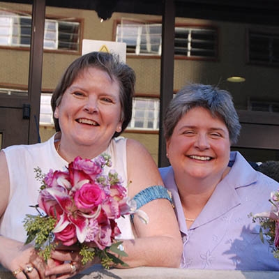 Mary Bishop and Sharon Baldwin greet well-wishers following their wedding ceremony Oct. 6 on the steps of the Tulsa County Courthouse. Bishop and Baldwin were the lead plaintiffs in a lawsuit against Oklahoma's ban on same-sex marriage, which they filed in 2004. They were finally issued a marriage license after the U.S. Supreme Court denied Oklahoma's appeal in the suit, and they exchanged vows later that day.