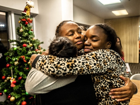 Mercedes Love hugs her daughters, Le’Airra Jones and Frantazia Jones as they say goodbye at the end of their visit.