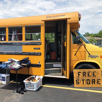 The Bad Business bus is a pop-up shop with clothes, toiletries, books, and more—all for free to people in need. 