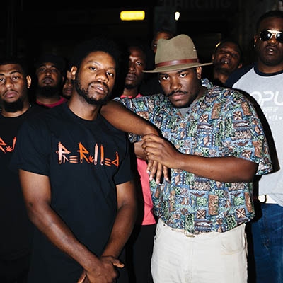 Keenan Lane and Steph Simon, creators of World Culture Music Festival, surrounded by festival performers
