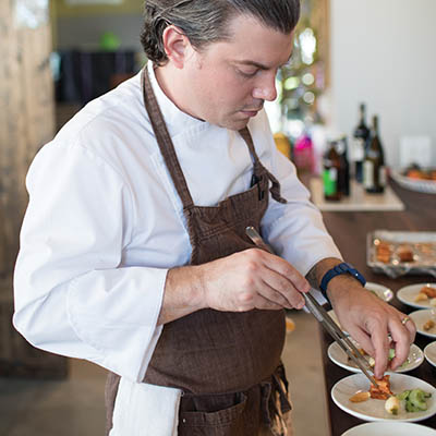 Executive Chef Matthew Owen arranging pickle plates