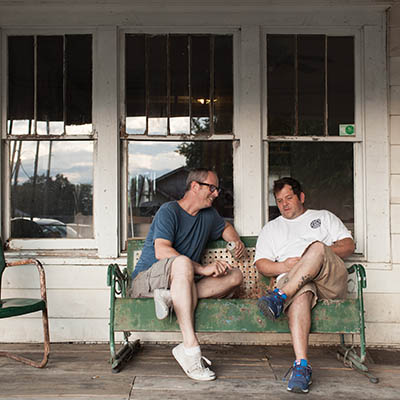 Zach Matthews and Donnie Rich on the front porch of the Curtis house