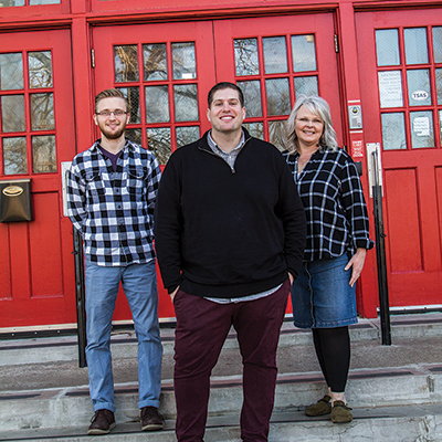 Tulsa School of Arts and Sciences employees Tyler Kinshella, seventh grade science and geology teacher; Dan Hahn, middle school principal; and Lisa Smith, lead principal