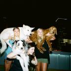 Girls exercise with their dogs at The Boxyard.