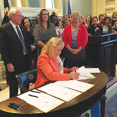 Mary Fallin signing criminal justice reform bills on April 26