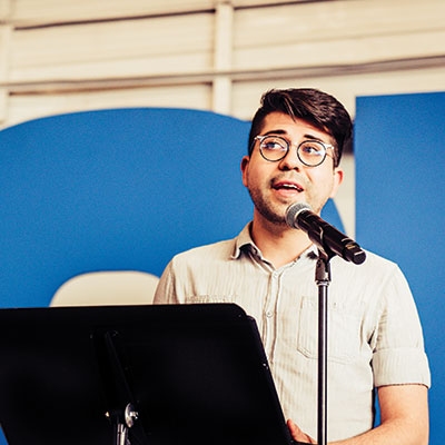 Cristian Solano-Córdova tells his family’s immigration story at the ACLU’s centennial commemoration in Denver. 