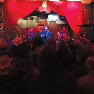 Scott Evans, Mike McClure and Paul Benjaman (right to left) perform at Mercury Lounge at Tom Skinner’s Skyline Music Festival in 2018.