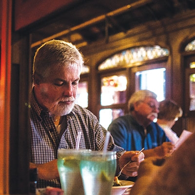 A diner enjoys one last meal in the trolley at Spaghetti Warehouse days before the restaurant closed permanently.