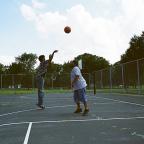 Guys play basketball at O’Brien Park