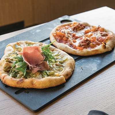 Half-size, half-price pizzas during happy hour at Prairie Fire Pie