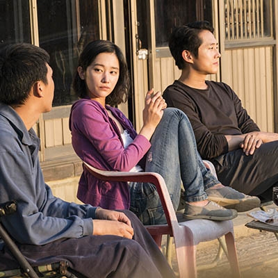 Yoo Ah-in, Jong-seo Jeon, and Steven Yeun in “Burning”