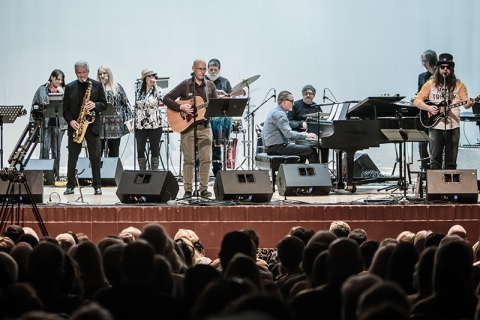 Paul Benjaman leads the band at Will Rogers High School, paying tribute to alum Leon Russell