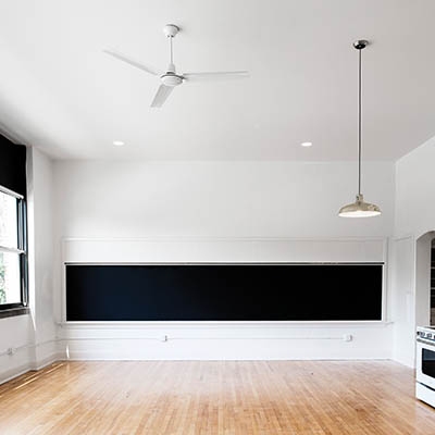 Live/work studio apartment with original chalkboards and vintage-inspired appliances at Pershing Studios