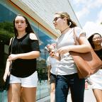 Girls walk past Center 1 on Brookside