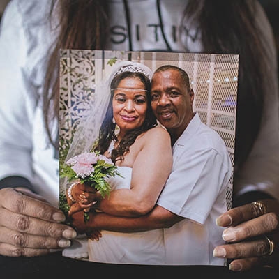 Chestine Gooden holds a wedding portrait of herself and husband Jeffery Gooden, who was killed in Tulsa on January 1, 2017