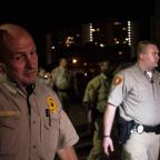 Police block protesters trying to march to the back of the courthouse where they believed Officer Betty Shelby would exit.